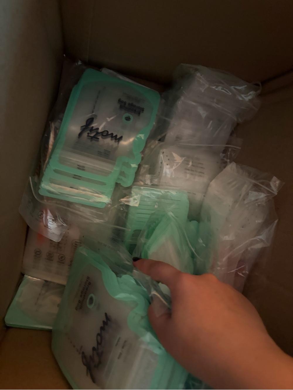 Box filled of hundreds of breastmilk storage bags